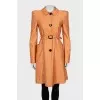 Orange trench coat with belt