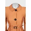 Orange trench coat with belt
