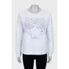 Sweatshirt with embroidery and perforation