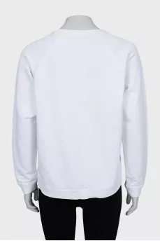 Sweatshirt with embroidery and perforation