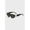 Sunglasses with golden brand logo