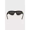 Sunglasses with golden brand logo