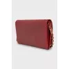 Leather clutch with brand logo