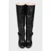 Leather boots decorated with a bow