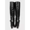 Leather boots decorated with a bow
