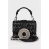 Leather bag decorated with crystals