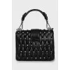 Leather bag decorated with crystals