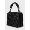 Leather bag decorated with crystals