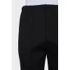 Tapered trousers with zippers on the sides
