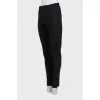 Tapered trousers with zippers on the sides