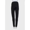 Tapered trousers with zippers on the sides