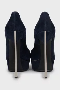 Blue suede shoes with a figured heel