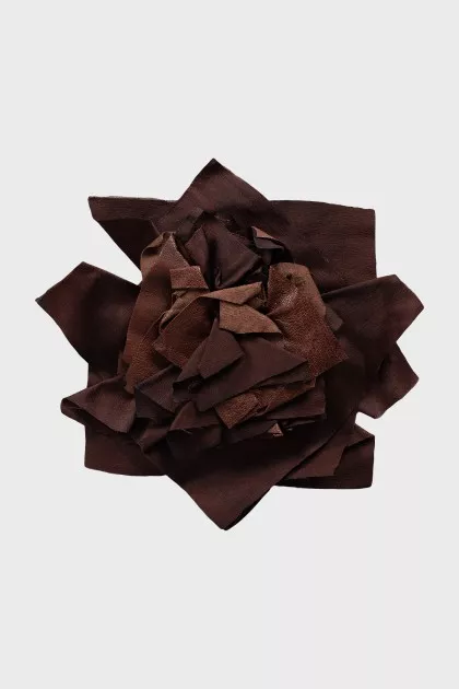 Brooch made of textile and leather