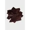Brooch made of textile and leather