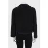 Black jacket with accent buttons
