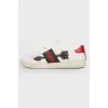 White leather sneakers with colored inserts