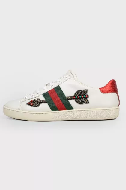 White leather sneakers with colored inserts