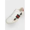 White leather sneakers with colored inserts
