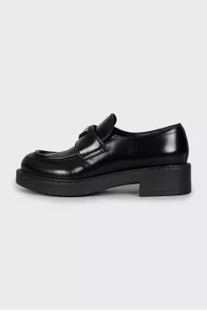 Leather loafers with silver logo