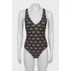 Swimsuit with branded monogram with tag