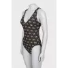 Swimsuit with branded monogram with tag