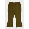 Green flared trousers with tag
