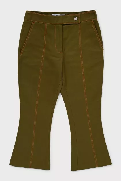 Green flared trousers with tag