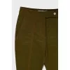 Green flared trousers with tag
