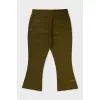 Green flared trousers with tag