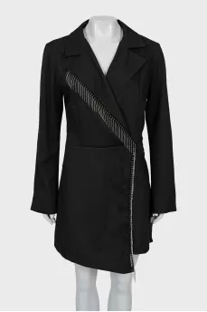 The jumpsuit with shorts is decorated with fringe