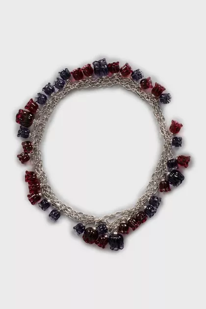 Silver necklace decorated with flowers