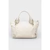 Dairy leather bag with golden fittings