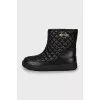Black ugg boots with gold logo
