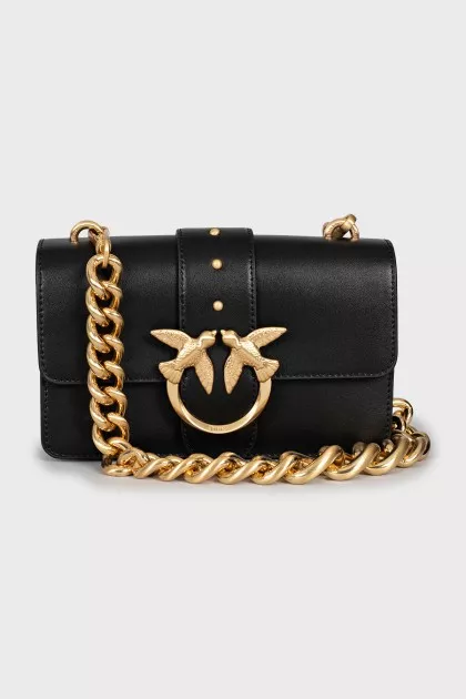 Leather bag with a massive strap