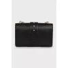 Leather bag with a massive strap