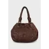 Leather bag decorated with chain
