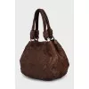 Leather bag decorated with chain