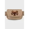 Belt bag made of textile with a signature print