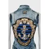 Denim vest with crystals on the back