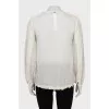 White silk blouse with fringe