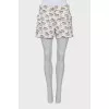 White shorts with signature print