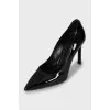 Black patent leather pumps