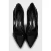 Black patent leather pumps