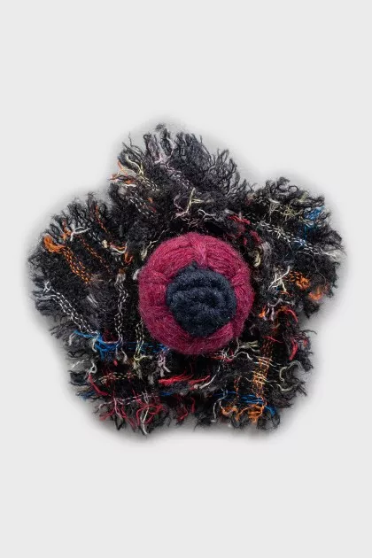 Brooch with raw edge