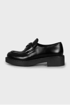 Leather loafers with metal decor