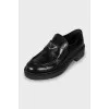 Leather loafers with metal decor