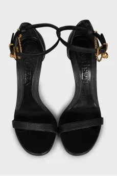 Leather sandals with golden skulls