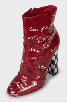 Leather ankle boots decorated with inscriptions
