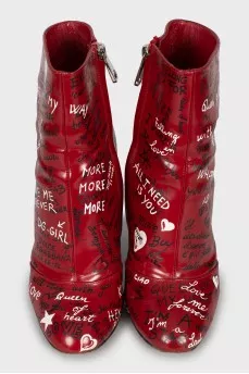 Leather ankle boots decorated with inscriptions