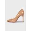 Patent leather shoes made of beige leather